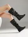 Side detail of black mid-calf pleated slouchy boots with decorative buckle straps - 34 / Black