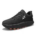 Breathable black outdoor athletic shoe with thick textured sole and orange outsole studs - 36 / Black