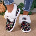 Detail showing the white faux fur collar and colorful patterned upper of winter boots. - 35 / Skull