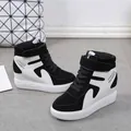 Side view detail of black and white high-top wedge sneakers with velcro straps and laces. - 35 / Black