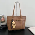 Brown textured faux leather tote bag for women with cute teddy bear charm accessory - With Pendant / Brown