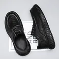 Detail shot of black leather work shoe with non-slip bubble texture sole. - 39 / Lace-up Style / Black