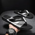 Non-slip black and white men's beach flip flops with embroidered LOULUEN strap - 39 / Black