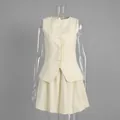 Front detail shot of pale yellow sleeveless vest and matching flared mini skirt set - S / Top And Bottom / Apricot