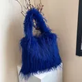 Large electric blue faux fur tote bag with long fringe for autumn and winter fashion styles - Sapphire Blue