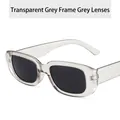 Modern square sunglasses with a transparent grey frame and dark grey lenses. - Translucent Grey Frame Grey Lens