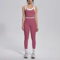 Full view of a dusty rose and white color-block high-waisted yoga set on a model - S / Top And Bottom / Violet