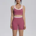 Close-up of color-blocking yoga set featuring a sports bra and high-waist shorts - S / Top And Bottom / Violet
