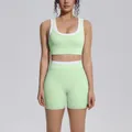 Front view detail of a mint green ribbed high waist yoga set with white contrast trim - S / Top And Bottom / Mint Green
