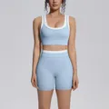 Front view of a light blue and white color-blocking high-waisted yoga set on a model. - S / Top And Bottom / Mist Blue