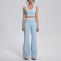 Full-body view of light blue color-blocked yoga set with sports bra and flared pants - S / Top And Bottom / Mist Blue