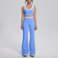 Stylish blue two-piece yoga set featuring contrast sports bra and high-waist flare leggings - S / Top And Bottom / Sky Blue