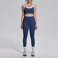 Full body view of navy and white contrast color high-waisted yoga bra and leggings set. - S / Top And Bottom / Badge Blue