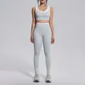 Full view of light gray yoga set with white contrast trim on a fitness model - S / Top And Bottom (7154) / Clay Grey