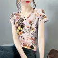 Elegant women's short-sleeved t-shirt with vintage floral print and round neck design - M / Tops / Apricot Floral