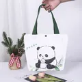 Weiße Canvas-Tragetasche mit einem süßen Panda-Aufdruck und grünen Gurtbandgriffen - Panda-Druck / 27*22*10cm