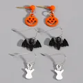 Detail view of Halloween earring set featuring pumpkin, bat, and ghost motifs on gray background. - Pumpkin Bat Ghost Set (2311) / 3 Pairs Set
