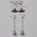 Detailed view of Halloween earring set with skull studs, bat hooks, and spider chains - Gothic Bat Spider Set (Style B) / 3 Pairs Set / Silver/Black