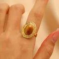 Vintage golden stainless steel ring featuring an oval tiger eye stone and hollow woven band - 椭圆虎眼石编织款式(Z-383) / 18K Gold