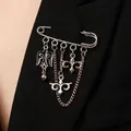 Elegant silver safety pin brooch featuring Kazakh ethnic motifs with dangling chains and charms - Kazakh Totem Tassel Style (7495) / Silver Black