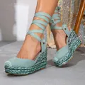 Close-up of mint green wedge sandals featuring sparkling rhinestones and lace-up straps. - 36 / Green
