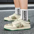 Stylish cream and green casual sneakers featuring unique camouflage print fabric panels - 38 / Brown