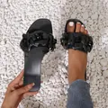 Stylish black flat jelly sandals featuring 3D floral decoration for beach wear. - 36 / Black