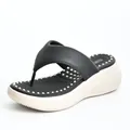 Detail view of platform flip-flop with massage footbed and thick wedge sole - EU 36 / Black