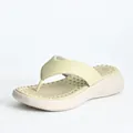 Detailed side view of women's platform flip-flops with massage footbed and soft sole - EU 36 / Light Green