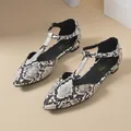 Close-up detail of elegant snakeskin pattern T-strap flat shoes with pointed toe - 7 / Leopard Print