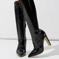 Detailed macro view of black crocodile embossed patent leather on high heel boots - Black (11cm Heel) / 38
