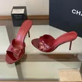 Close-up of glossy red stiletto mule with elegant open-toe design and slim high heel - 35 / Burgundy
