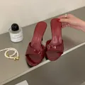 Close-up of elegant burgundy patent leather stiletto mules in a stylish setting - 35 / Burgundy