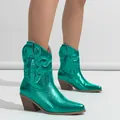 Macro view of metallic green cowboy boots featuring intricate Western embroidery and chunky heels - 35 / Metallic Green