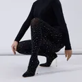 Detailed view of black rhinestone-embellished pant boots with pointed toe and stiletto heels. - 35 / Black