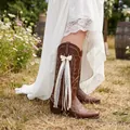 Detail view of a white ribbon bow accessory with lace and pearls on a brown cowboy boot. - 25cm / Ivory