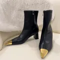 Detail view of black leather ankle boots featuring elegant metallic gold square toe caps - 38 / Block Heel Style / 5cm Heel Height / Black