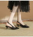 Elegant black pointed-toe kitten heel sandals with slingback strap on model - 38 / 4cm Block Heel / Black