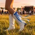 Blue and white bow ribbons accessory for cowboy boots on white western boots - Blue