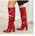 Detail of red patent leather knee-high boots with chunky heel and slouchy pleats design. - 38 / Patent Leather Style (10cm Heel) / Red Patent Leather