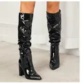 Close-up of black patent leather slouchy boots with pointed toe and chunky high heel - 38 / Patent Leather Style (10cm Heel) / Black Patent Leather