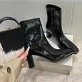 Close-up of black patent leather ankle boots with block heel and square metal toe - 38 / Chunky Heel Ankle Boots / Black (7cm Heel)