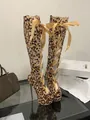Detailed macro view of leopard print lace-up high-heeled boots with platform and peep-toe design - 38 / Leopard Print