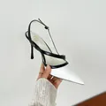 Elegant pointed-toe stiletto slingback sandals featuring a chic black and white colorway - 34 / White
