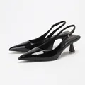 Elegant black patent leather pointed toe slingback pumps with a comfortable kitten heel for women - 35 / Black
