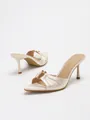 Elegant cream satin pointed toe stiletto mule sandals with gold hardware detail. - 35 / Apricot