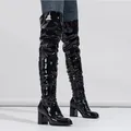 Full view of black shiny patent leather over-the-knee slouchy boots with chunky heels. - 38 / 7.5cm Heel / Black