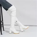 Detailed view of white patent leather slouchy over-the-knee boots with chunky heels - 38 / 7.5cm Heel / White