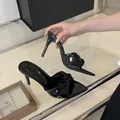 Elegant black patent leather pointed-toe high heel sandals with twisted knot detail - 35 / Black