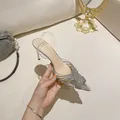 Elegant silver pointed-toe high heel sandals with rhinestone detail and clear straps. - 34 / Stiletto Silver